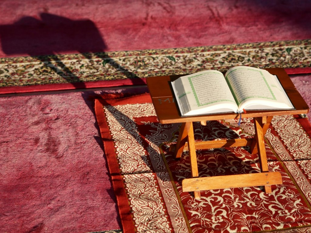 an open book sitting on top of a wooden table